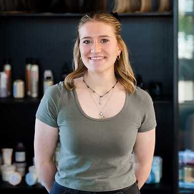 Portrait of Jill Codon, a professional stylist at Wisp Salon, showcasing their expertise and style.