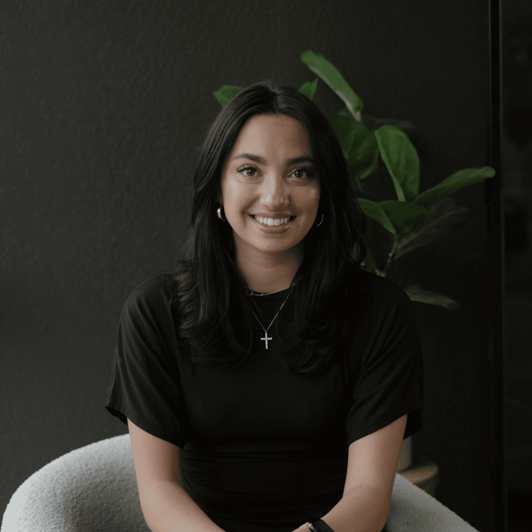 Portrait of Cate Garcia, a professional stylist at Wisp Salon, showcasing their expertise and style.