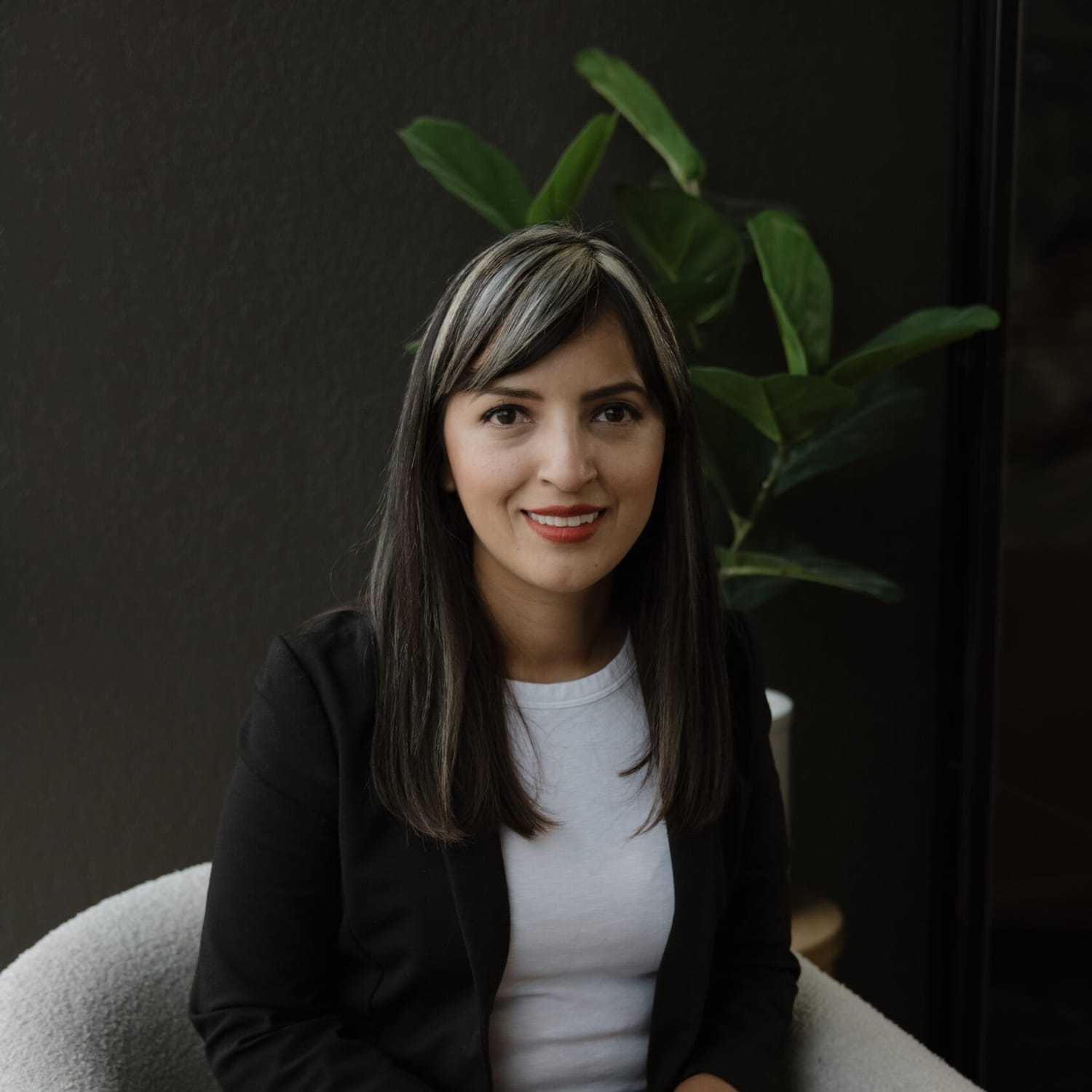 Portrait of Diana Ramirez, a professional stylist at Wisp Salon, showcasing their expertise and style.