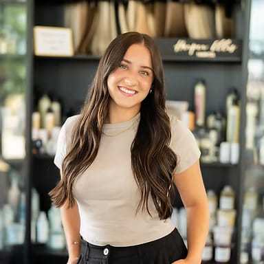 Portrait of Skyler Stratton, a professional stylist at Wisp Salon, showcasing their expertise and style.