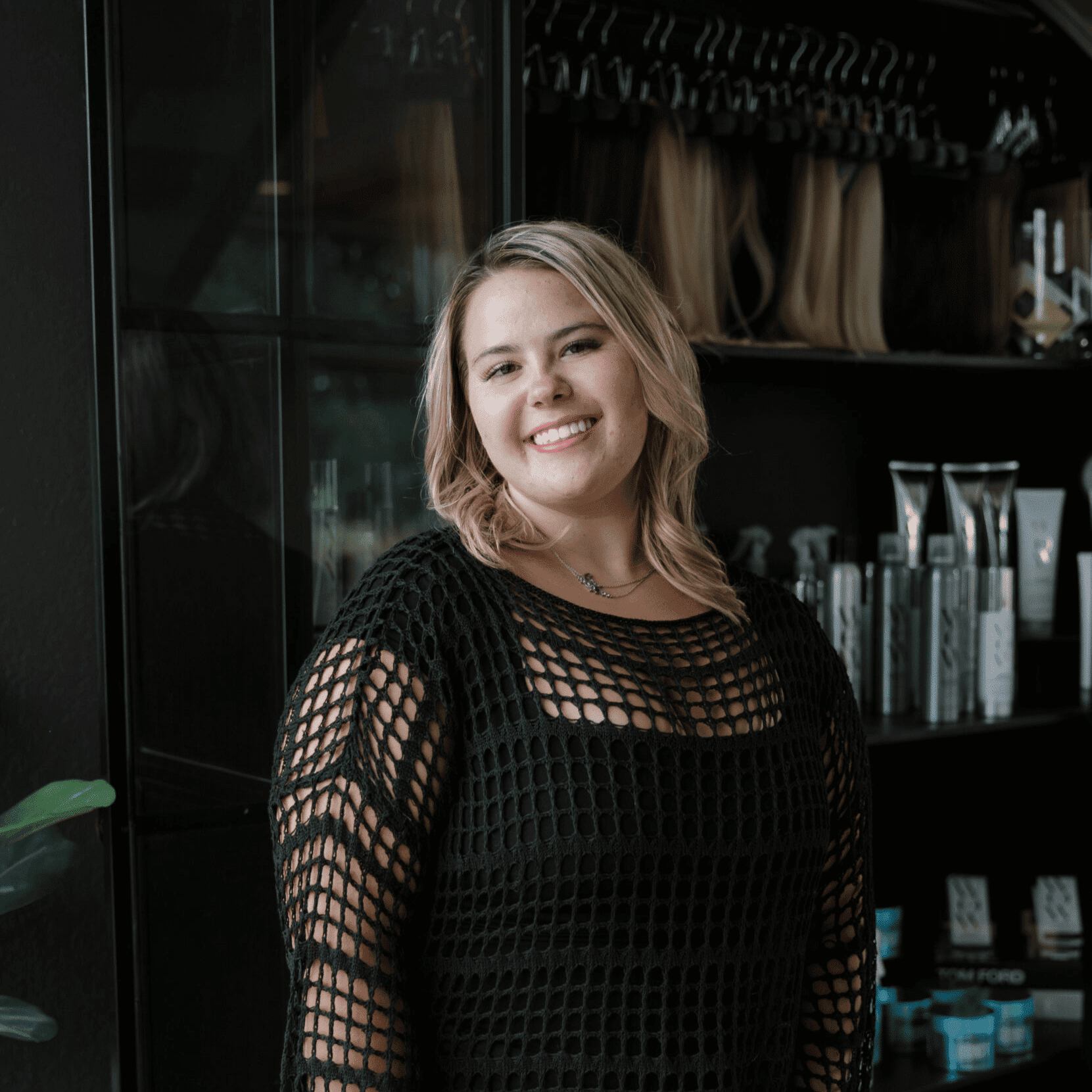 Portrait of Milana Danna, a professional stylist at Wisp Salon, showcasing their expertise and style.