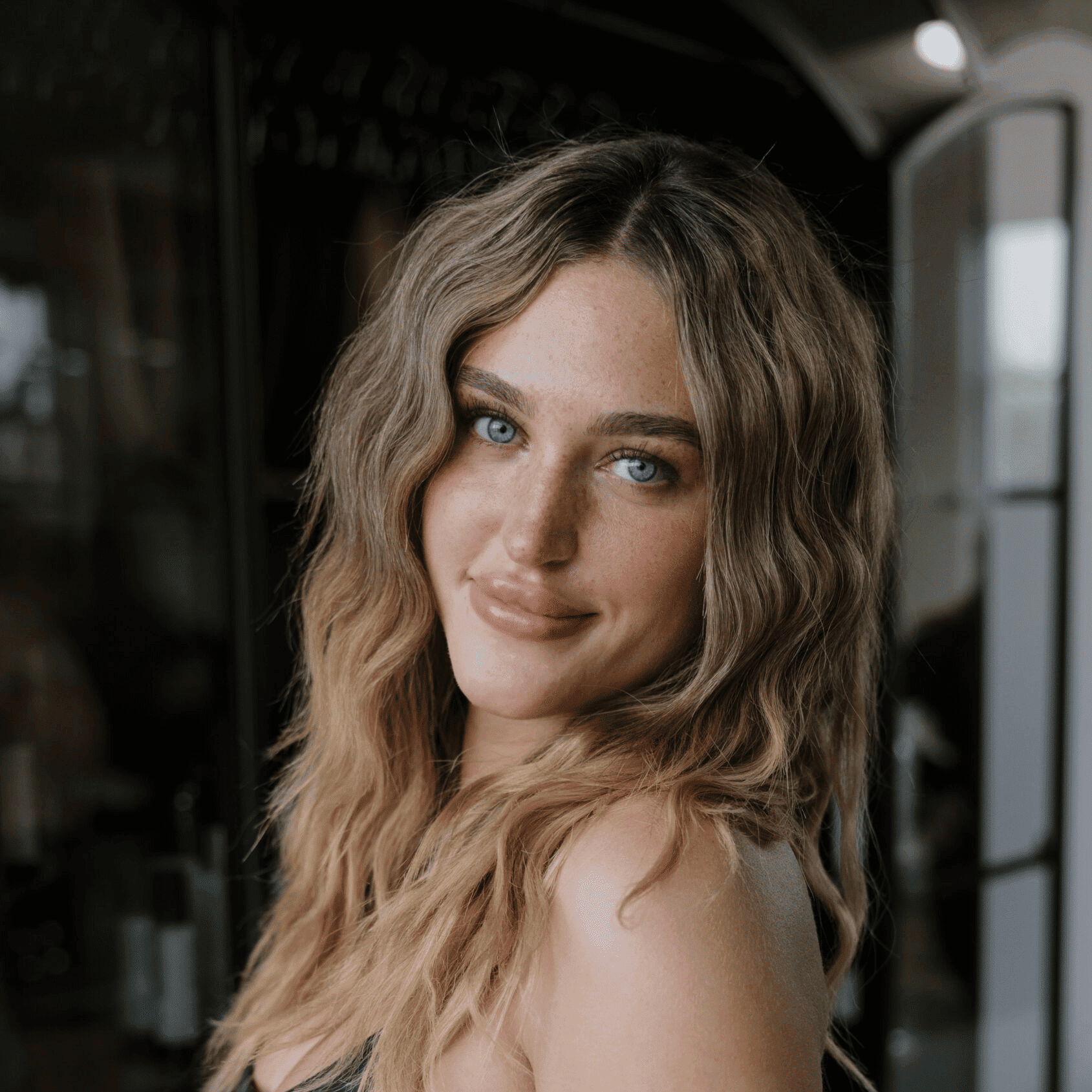 Portrait of McKayla Katz, a professional stylist at Wisp Salon, showcasing their expertise and style.